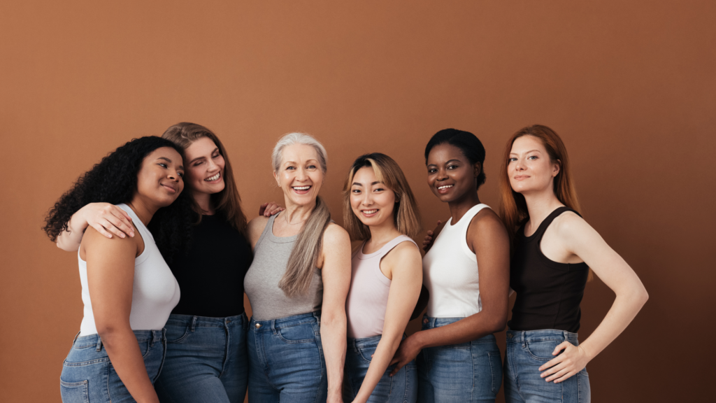 A group of happy women supporting each other, symbolizing strength, confidence, and overcoming a weak pelvic floor.